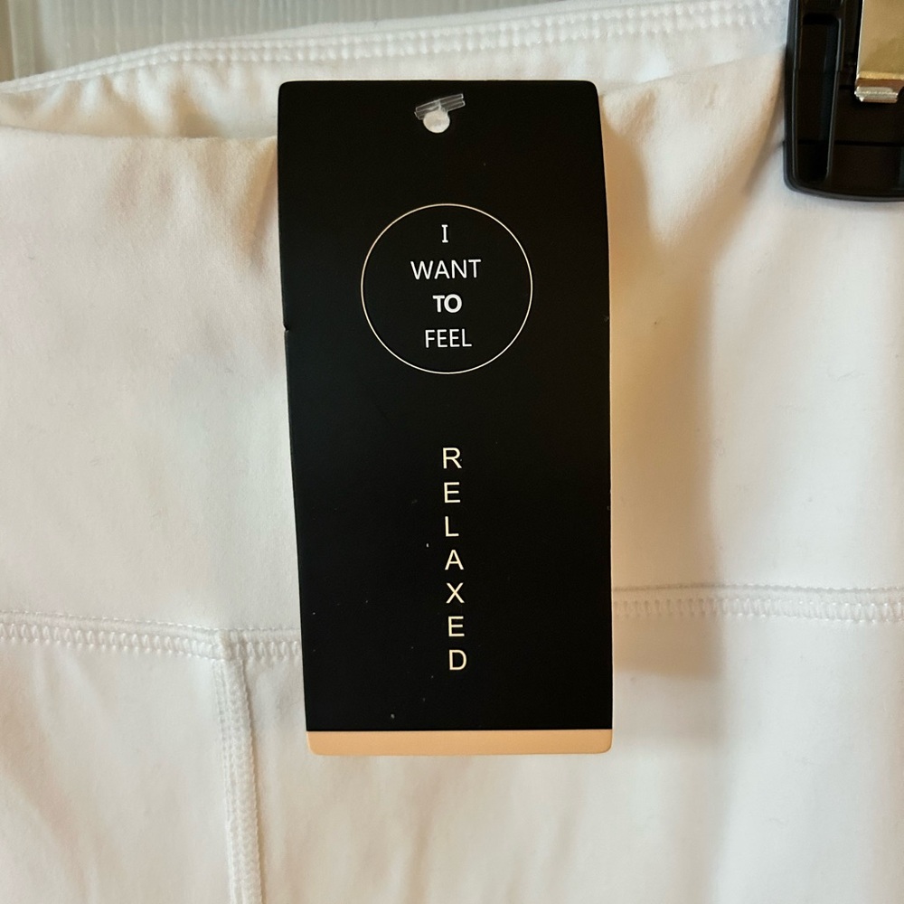 White Activewear Bottoms with Ball Pockets in the back and side pockets.